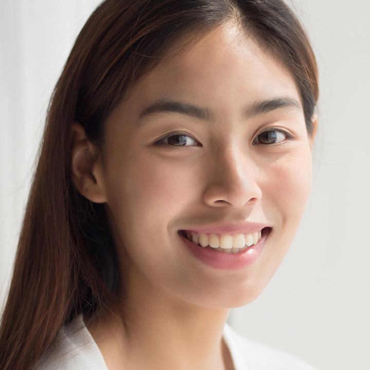 Happy woman after receiving dental scaling and root planing in Richmond, VA