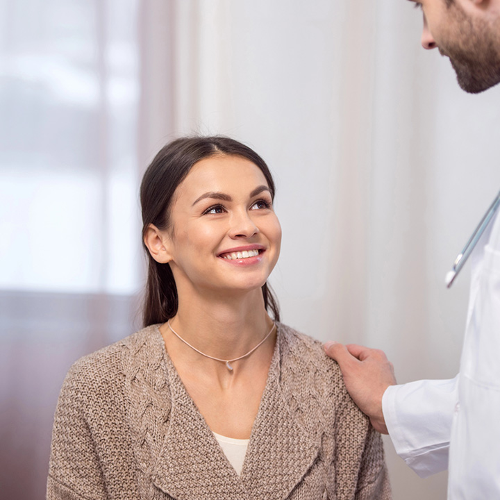 Happy woman after receiving oral cancer screening in Stafford, VA