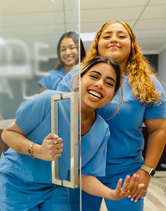 Team members at Karande Dental Care welcoming patients at the entrance